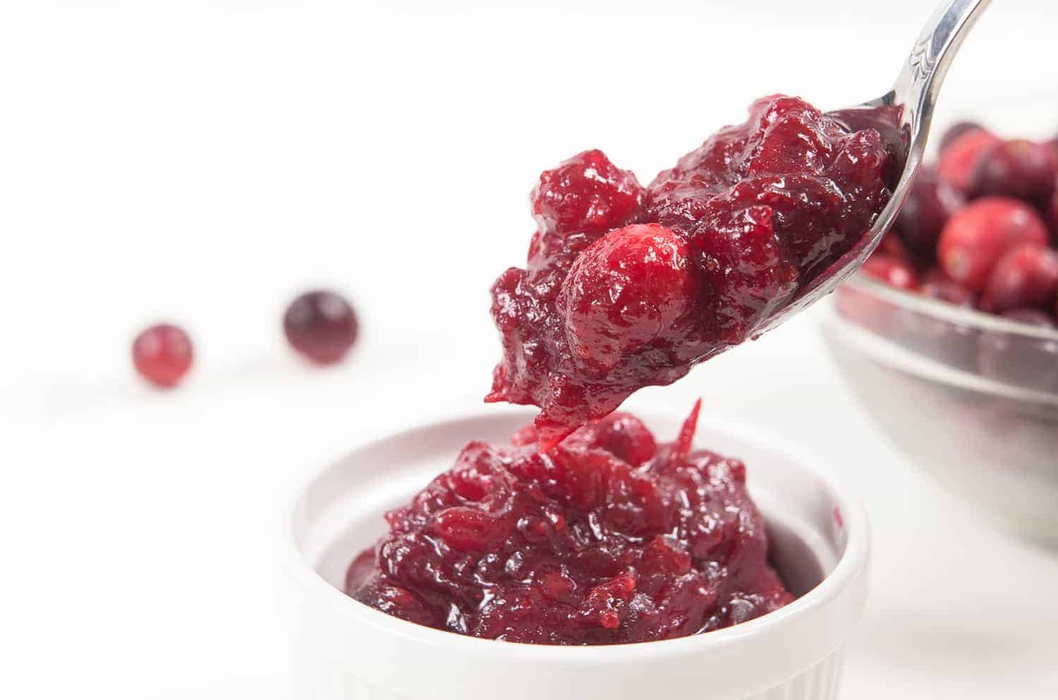 Easy Pressure Cooker Cranberry Sauce Recipe: Tangy & sweet fresh homemade cranberry sauce is great as a jam-like spread, topping for desserts, filling for pastries, glaze for meat, or extra flavor for yogurt/smoothie. Don't just save it for Thanksgiving dinner!