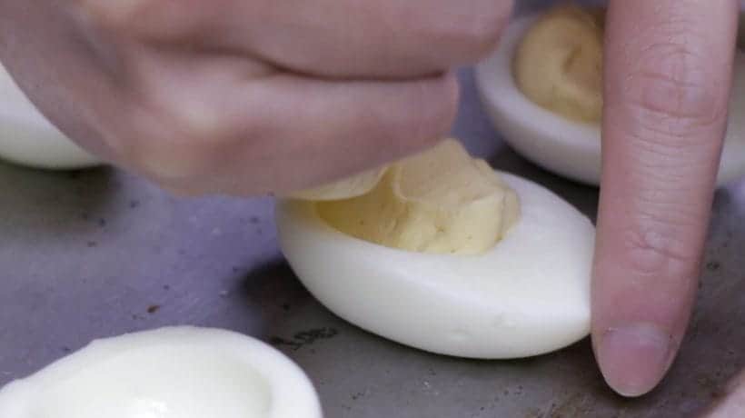 Instant Pot Deviled Eggs Recipe: Pipe deviled egg dressing into egg whites  #AmyJacky #InstantPot #PressureCooker #recipes #eggs