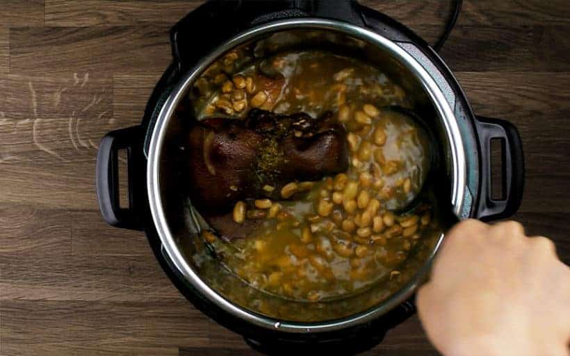 thicken soup by giving a few quick stirs with wooden spoon. Taste and season with kosher salt.