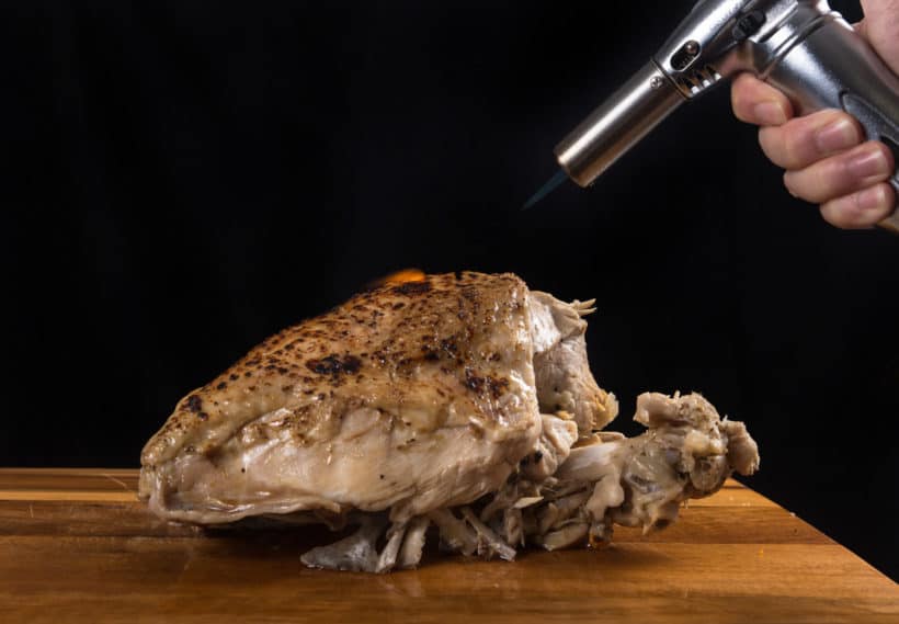 use blowtorch to crisp up turkey skin