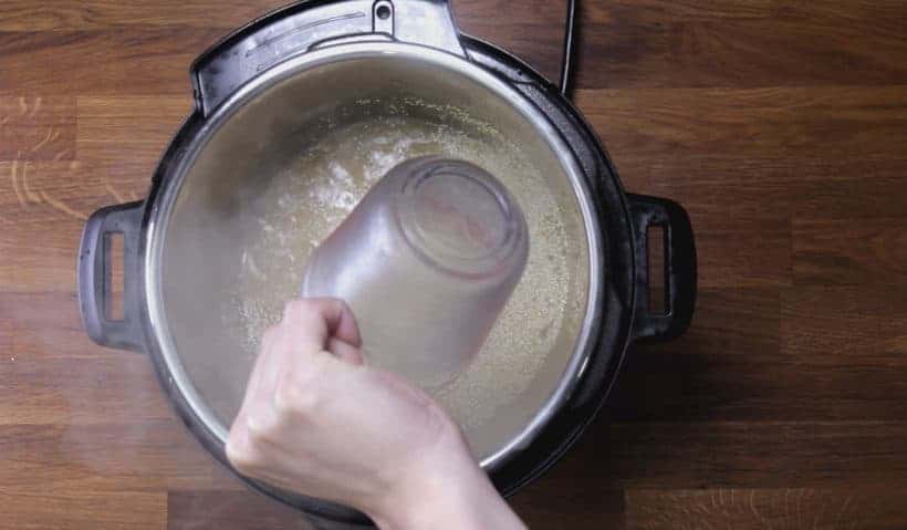 deglaze by scrubbing bottom of inner pot with wooden spoon