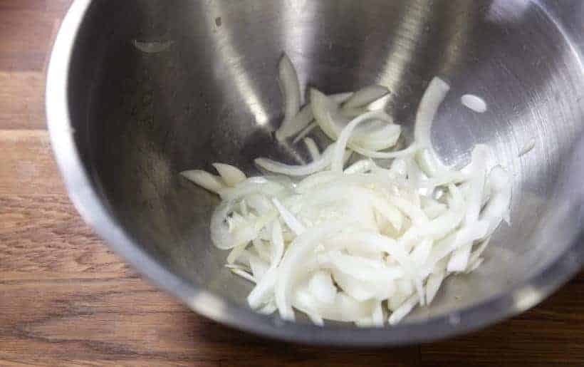 reserving sliced yellow onions 